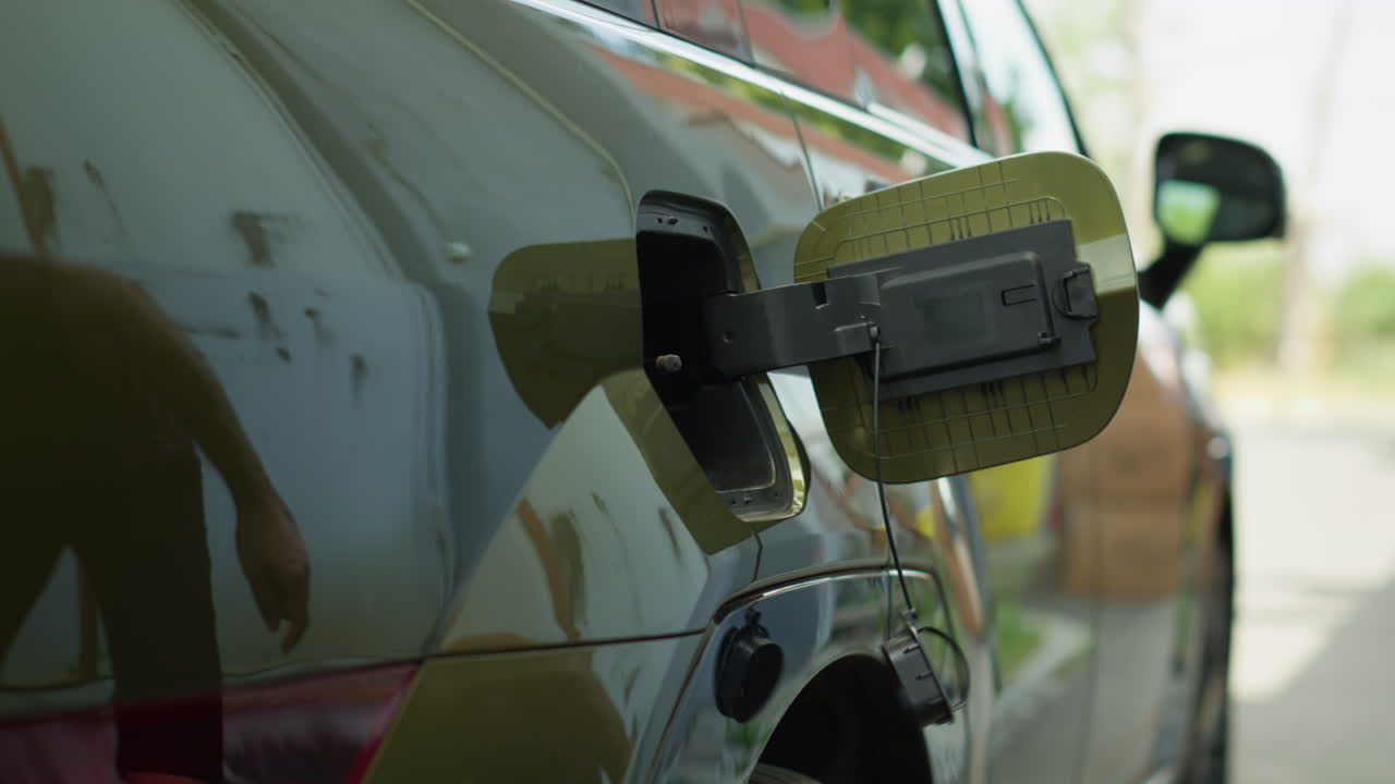 Close Up Of Driver Stopping Ev Car At Evse Station To Recharge It