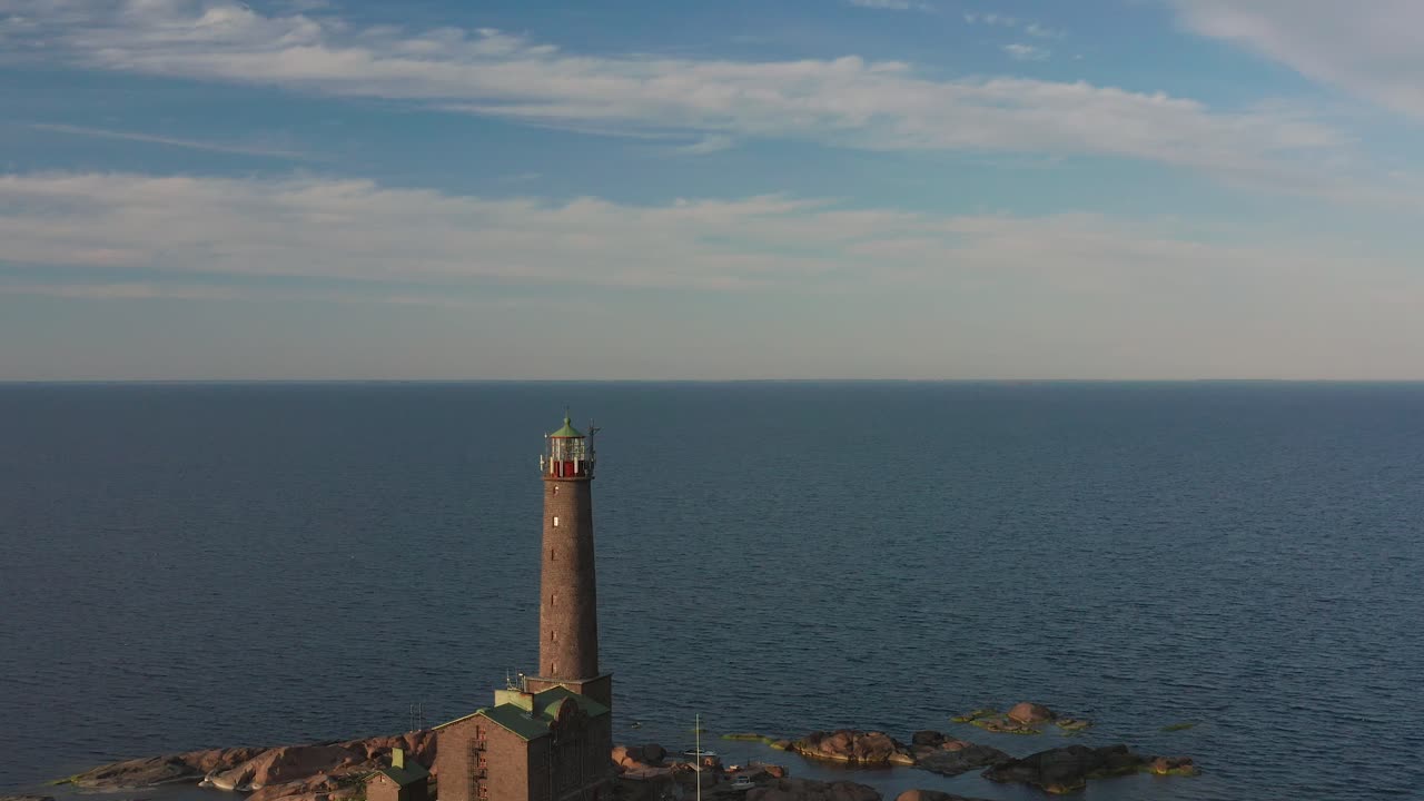 Aerial view of Bengtskär lighthouse during setting sun. The lighthouse is the tallest lighthouse in the Nordic countries and is famous for the beautiful surroundings.