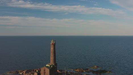 aerial view of bengtskär lighthouse during setting sun. the lighthouse is the tallest lighthouse in the nordic countries and is famous for the beautiful surroundings.