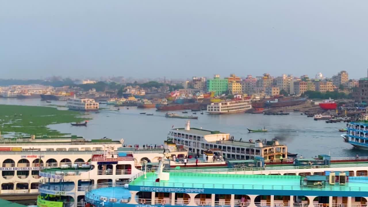 Passenger Ferry Ship At Sadarghat Launch Terminal In Buriganga River In Dhaka City, Bangladesh. Aerial Wide Shot