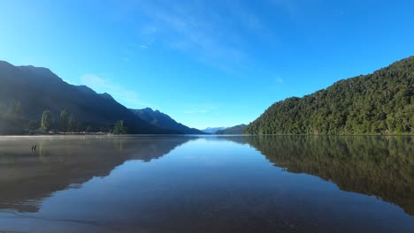 Time-Lapse-of-soft-movements-of-the-sky-and-Correntoso-Lake-at-sunrise,-in-Patagonia,-Argentina