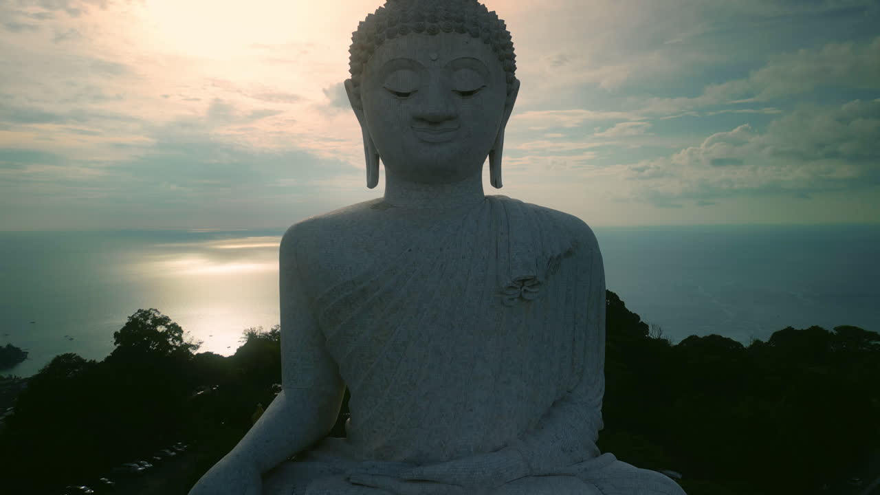 Giant Buddha Statue at Sunset with Ocean View