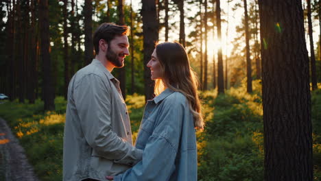 couple in love at sunset in the forest