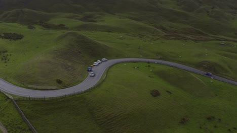 drone shot tracking a car driving along mam tor