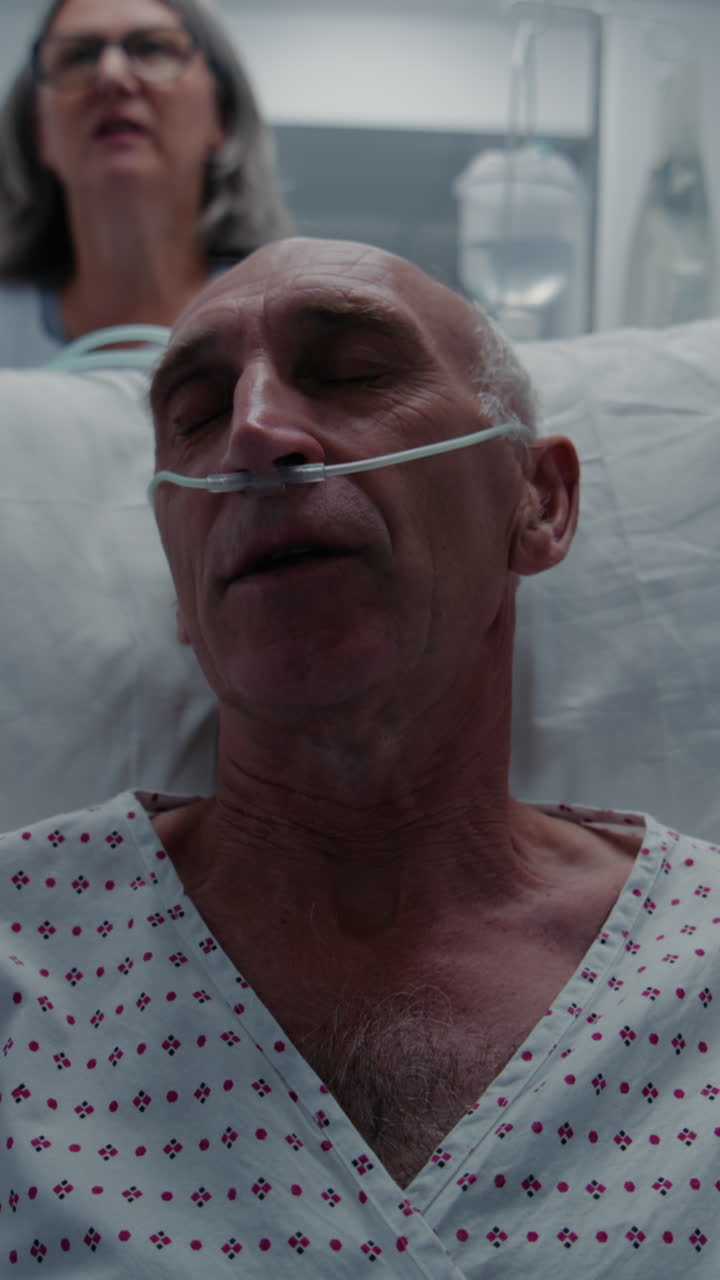 Old patient lies on gurney with breathing tube and 4k 2025 08 04 08 28 13 utc.mov | african american, breathing tube, care, caucasian