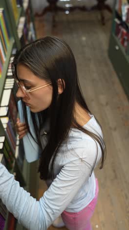 woman browsing books in a library