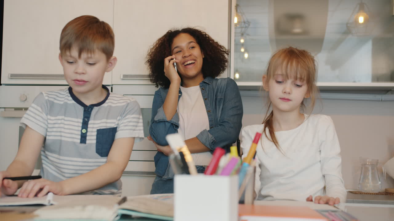 Kids Doing Homework in Kitchen