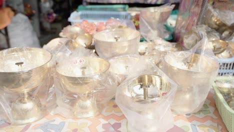 indian markets selling brass lamps (diyas