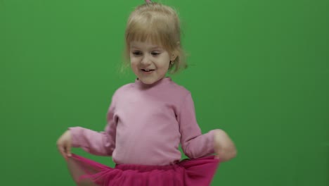 Happy-three-years-old-girl.-Cute-blonde-child.-Dancing-and-make-faces