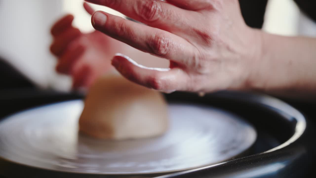 Potter's wheel potter works with his hands