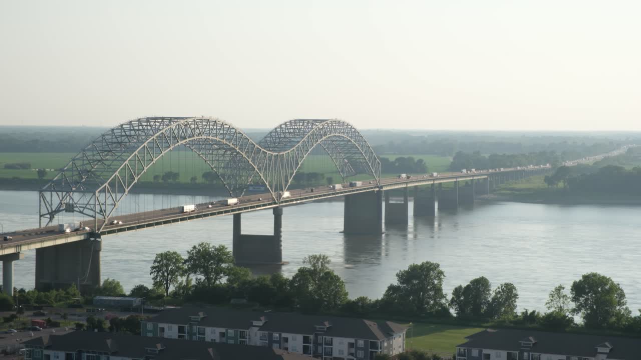 Telephoto panning shot of Interstate 40 Mississippi River Arkansas in the background