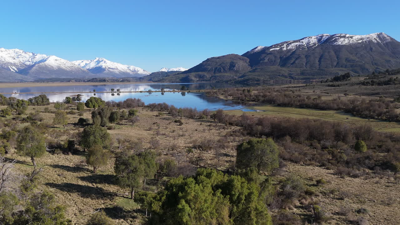 Beautiful landscape environment with drone on a tranquil lakeside, Laguna Terraplén, Trevelin, Argentina.