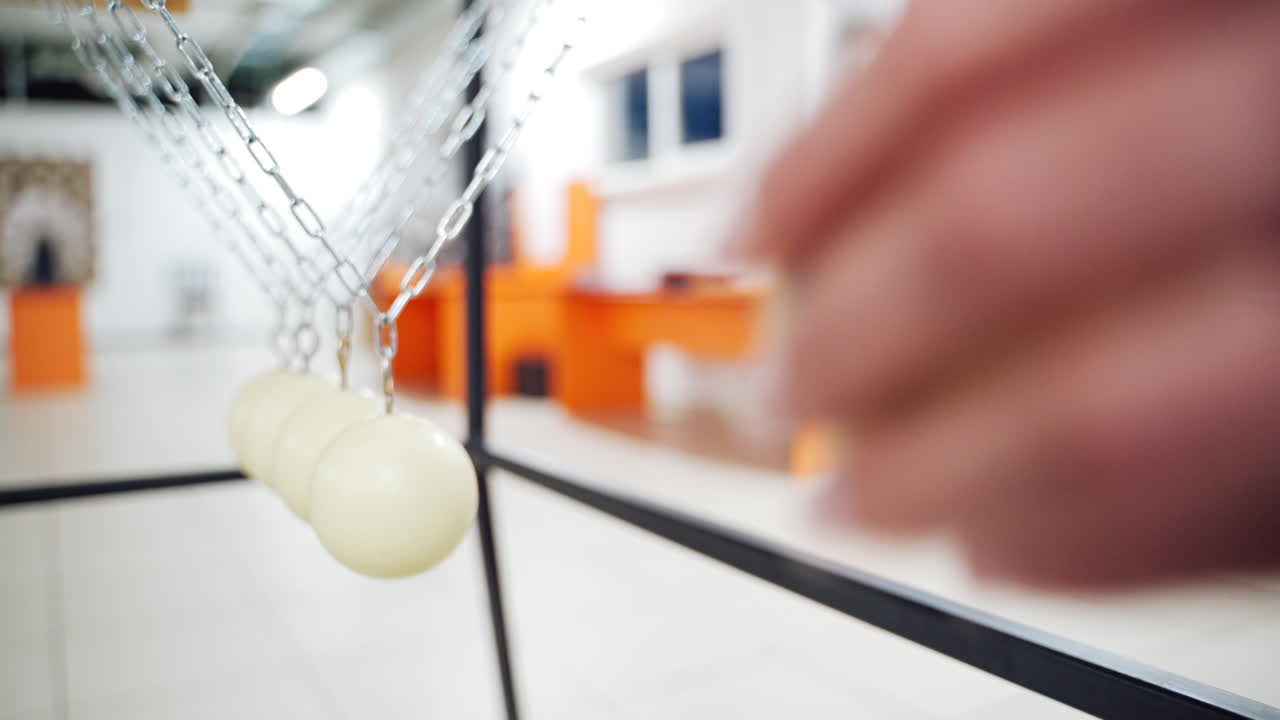 Balancing balls of Newton's cradle. Museum of Science