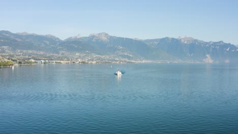 flying towards belle-epoque steam boat on lake léman with vevey, montreux and the alps in the background - switzerland