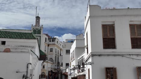 whitewashed buildings with wooden shutters and narrow streets in tangier medina, morocco