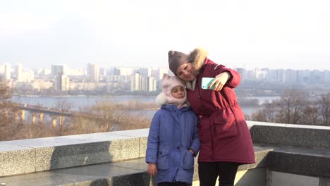 mother daughter on top of the roof in autumn