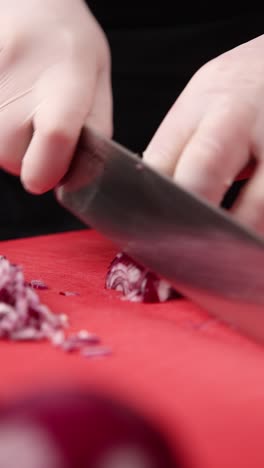 chef chopping red onion