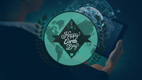 animation of happy earth day over hands of caucasian man using tablet