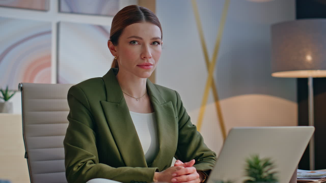 Positive businesswoman looking camera in workplace office closeup. Lady posing