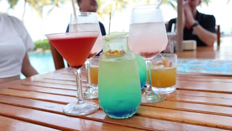 assorted drinks on a table at an outdoor setting