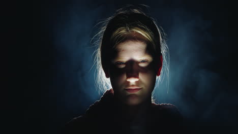 girl in a dark studio portrait