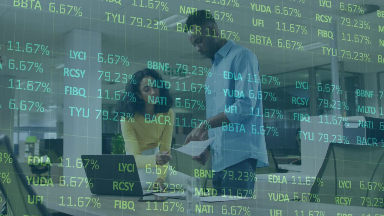 Animation of financial data processing over diverse business people using laptop in office