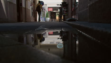 reflection in a puddle on a city street