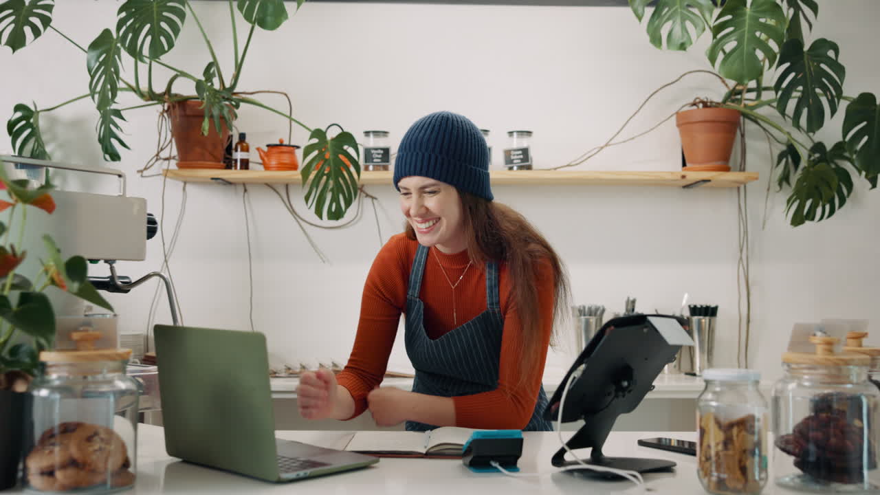 Excited business owner celebrates a successful sale
