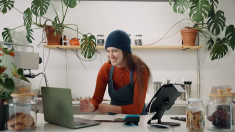 excited business owner celebrates a successful sale