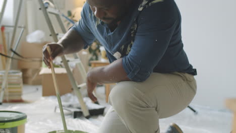 person painting a room