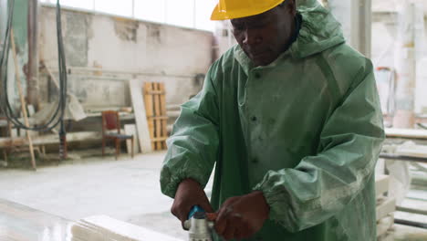 man polishing marble