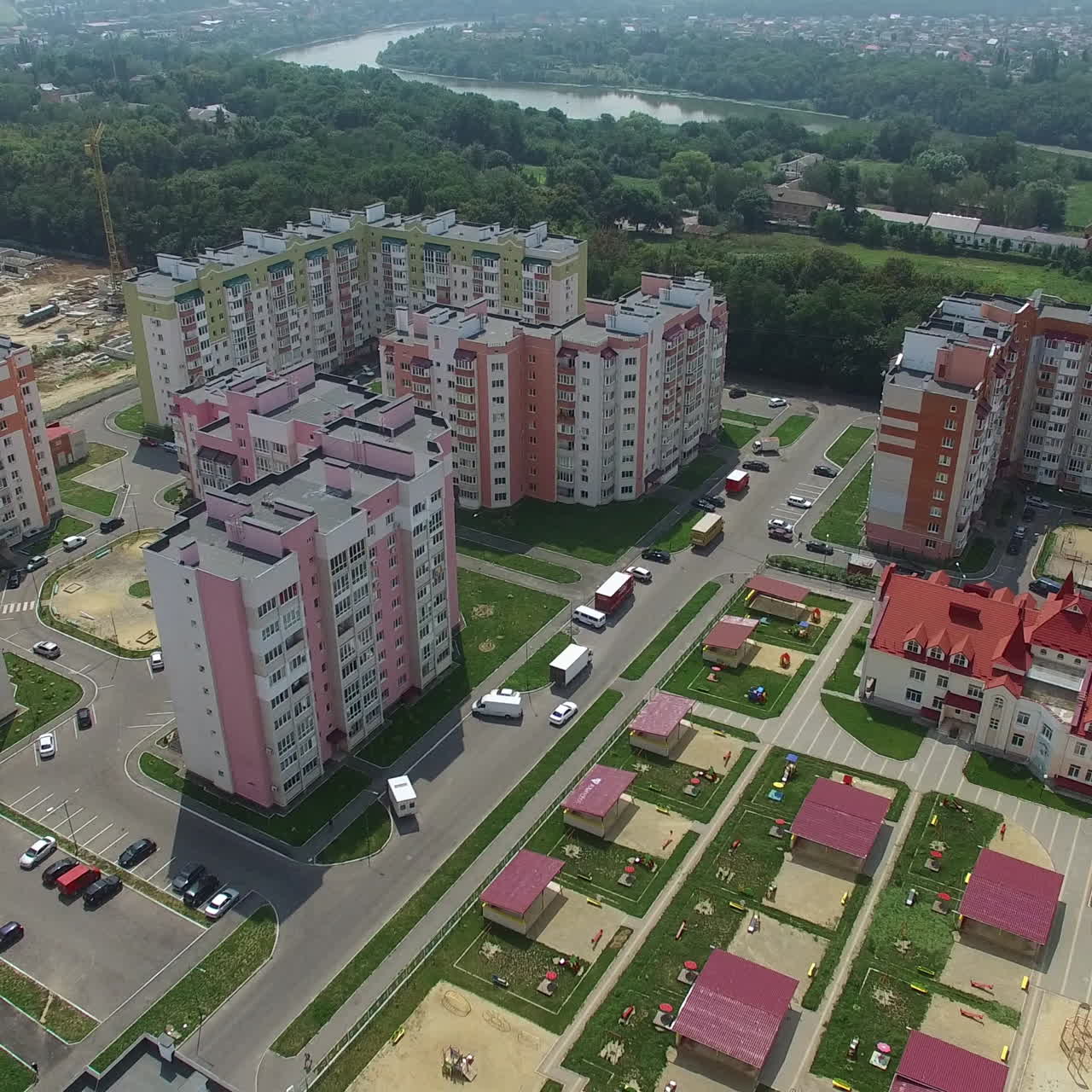Landscape of a modern district with high-rise buildings for people in a summer day. Camera motion around. Aerial view