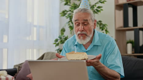 senior man celebrating birthday via video call