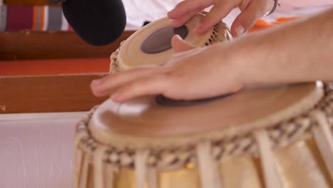 A-set-of-drums-being-played-at-an-Indian-wedding