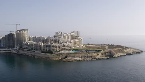 apartment complex on a small peninsula in valletta city,malta,aerial