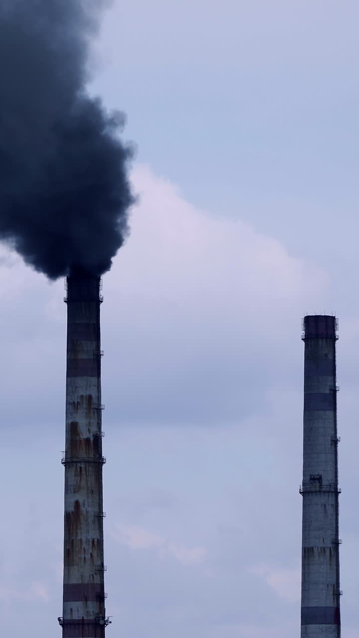 Factory pipes with smoke. Smoke of pipes pollutes atmosphere