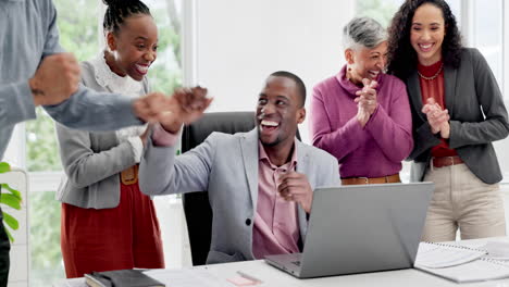 black man in office with laptop