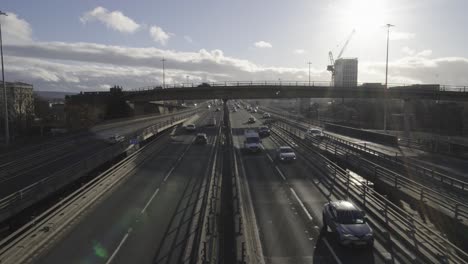 centre framed busy highway with sun providing lens flares