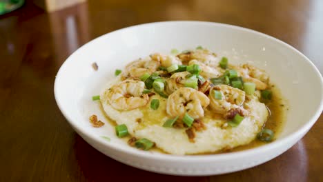 Steaming-plate-of-fresh-homemade-shrimp-and-grits---sliding-view