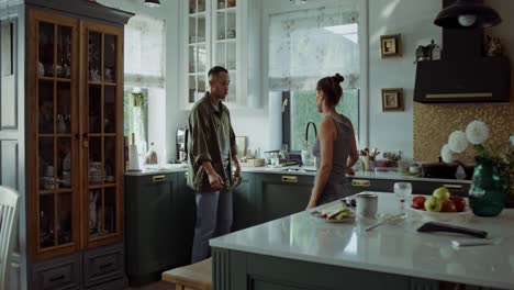 couple arguing in kitchen