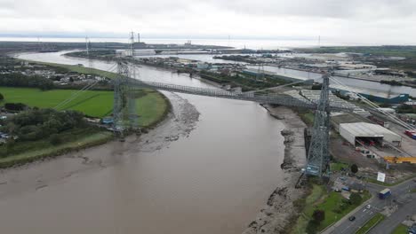 Restored-Newport-Transporter-industry-Bridge-aerial-orbit-wide-left-across-engineering-landmark-waterfront