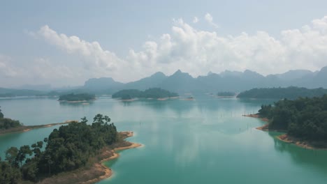 incredible drone footage of the rainforest and enormous mountains surrounding khao sok national park thailand