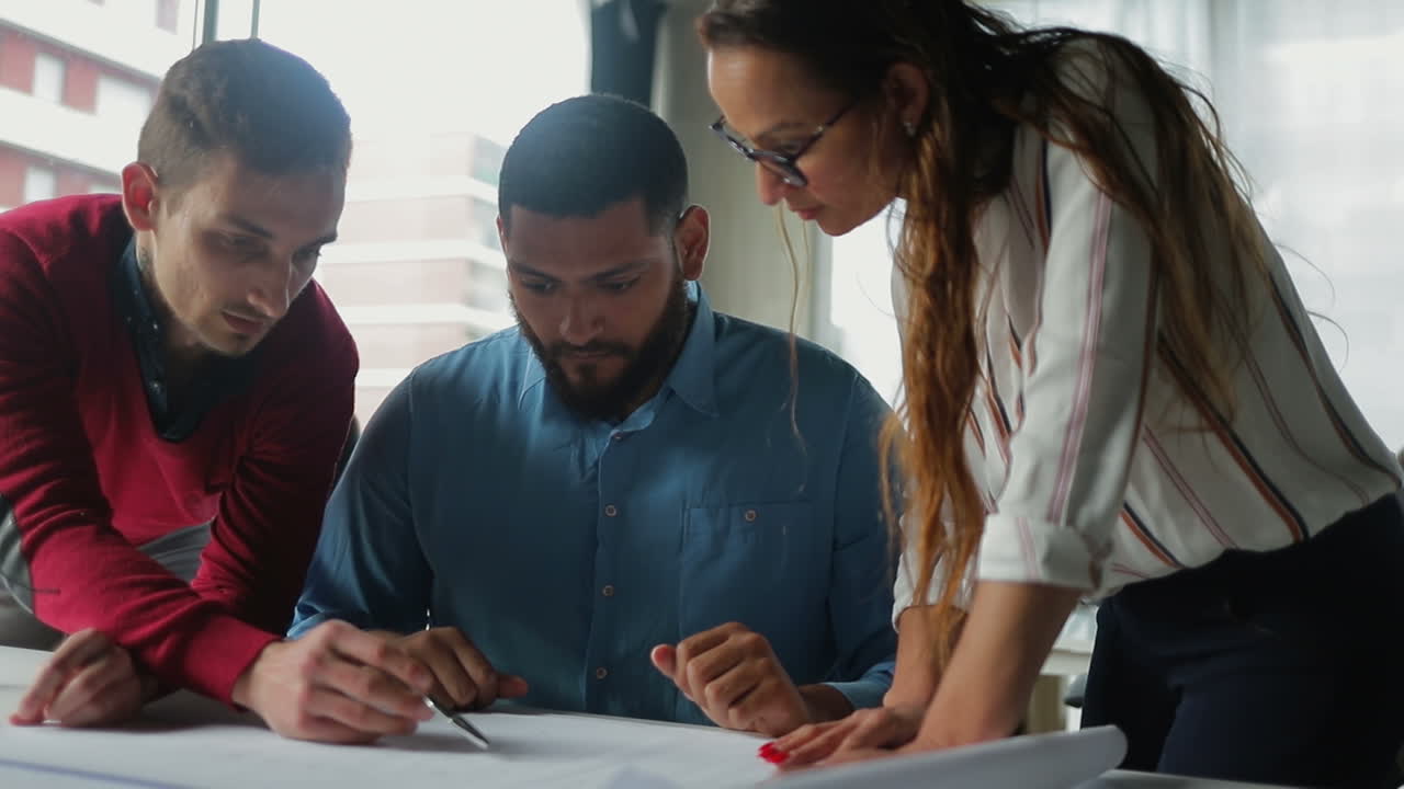 Confident architects discussing new architectural plan.
