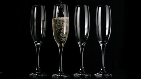 Champagne-flowing-in-super-slow-motion-in-flutes