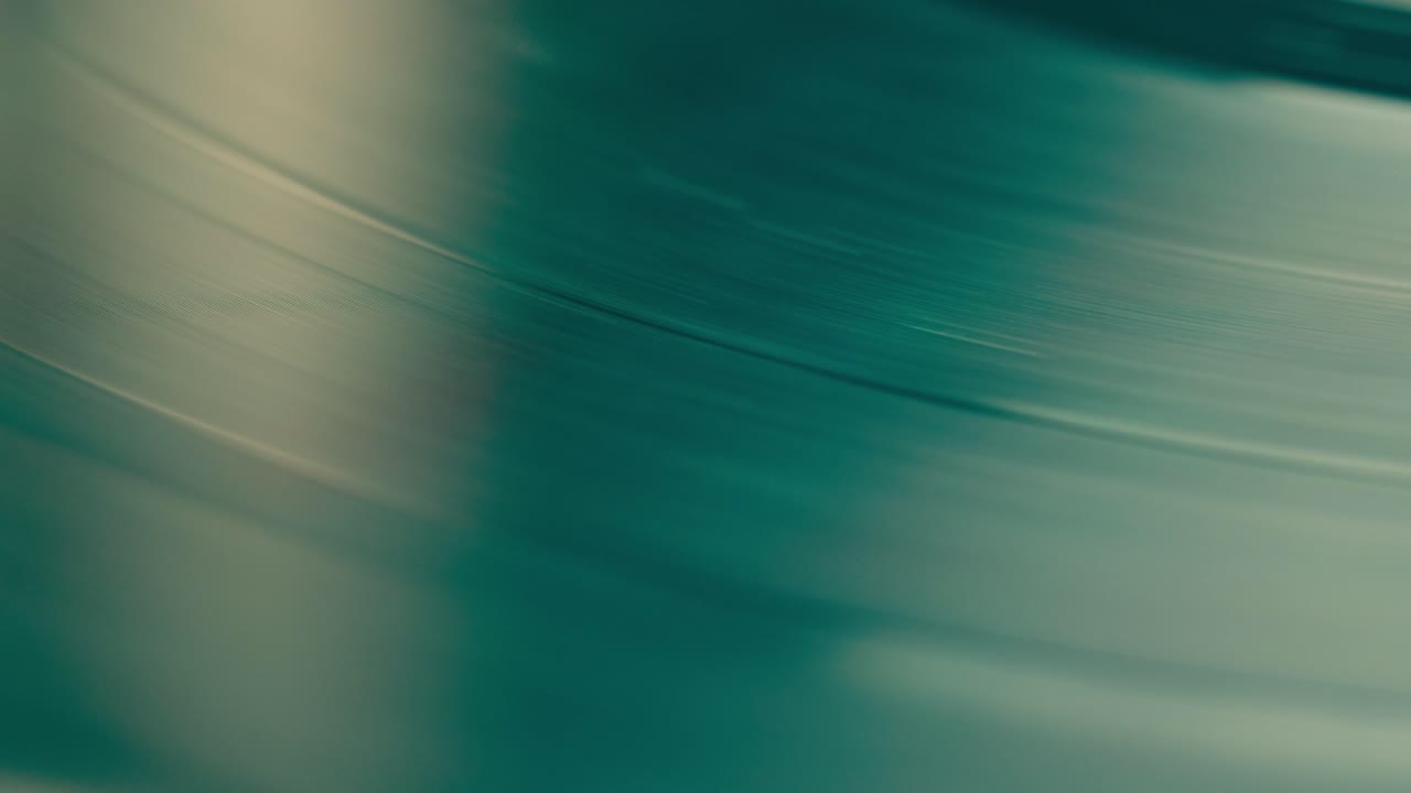 Record Spinning, Vinyl player Record Spinning, Spinning Vinyl Turntable Close Up, macro needle playing music, analog audio track. 4K Resolution.