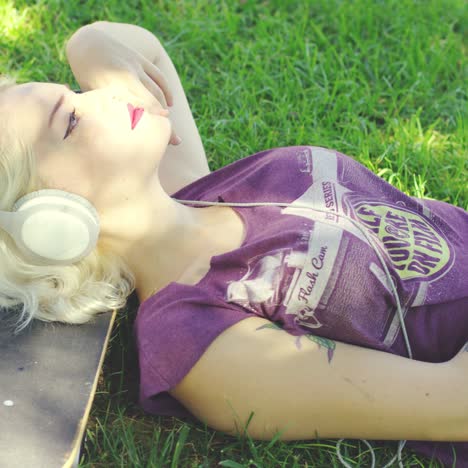 Young-woman-relaxing-in-the-shade-of-tree