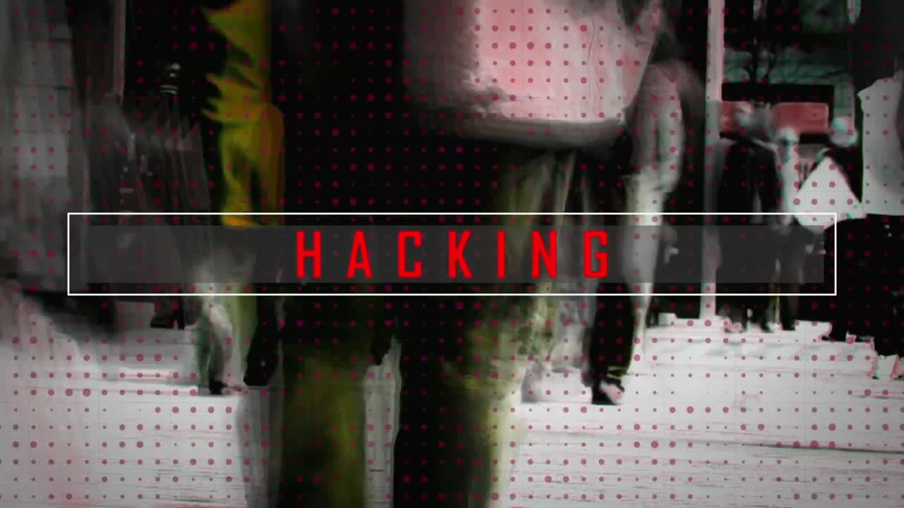 Animation of hacking text over people walking in city