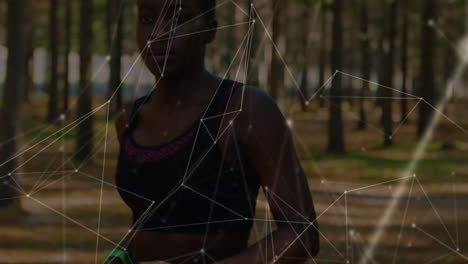 Animation-of-network-of-connections-over-woman-exercising-in-forest