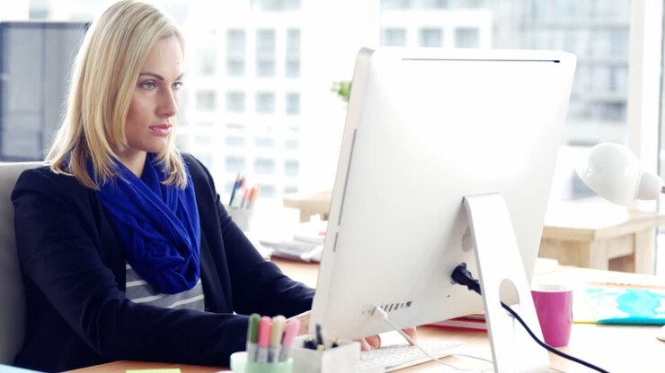 Portrait of businesswoman using computer