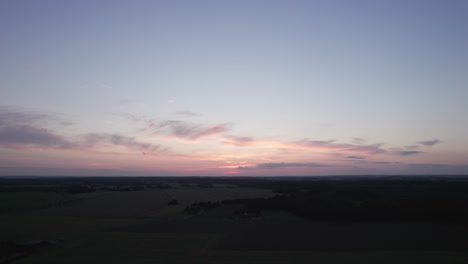 Flyover-View-From-Above-of-the-Danish-Countryside-Fields-and-Forest---Dolly-Shot